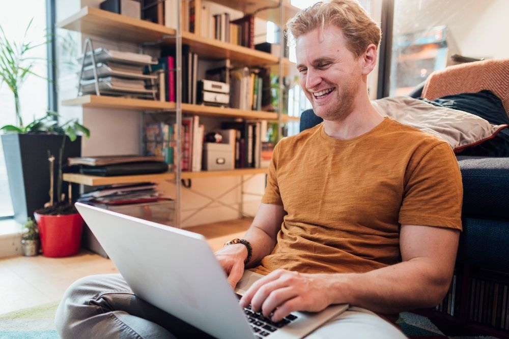 Happy Feeling Man with a Laptop